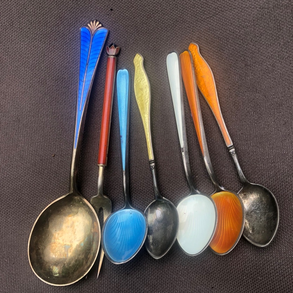 Seven sterling and enamel Demi tasse spoons
Plus 13 picks with stones